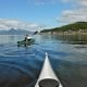 Image of kayakers on the water at Tenakee Springs, Alaska