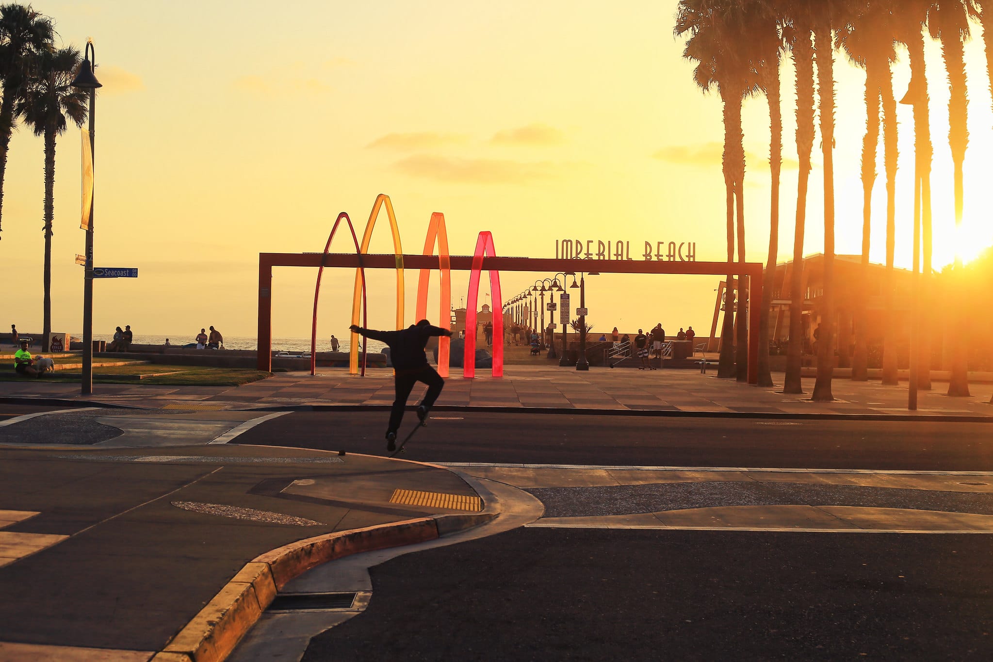 Image of a skateboarder at sunset at imperial beach city beach in california